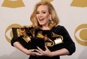Adele triumphs at Grammys with six awards